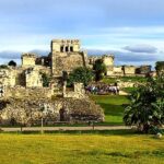 Ancient ruins in Tulum illuminated by natural light, inviting exploration and discovery on a Tulum private tour.